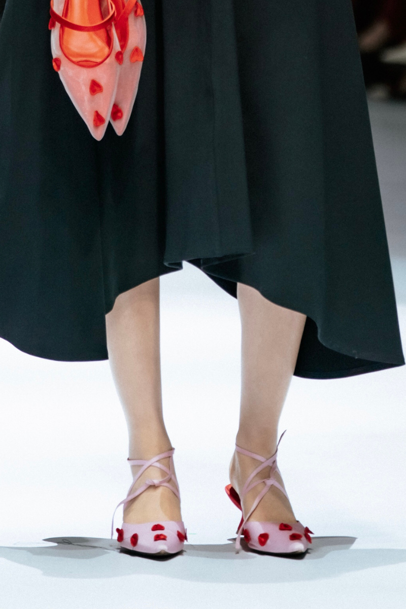Black Christin Wu Wenda heels with lotus flower design, featuring a sleek stiletto heel and elegant silhouette.