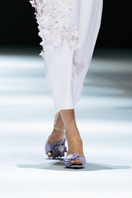 Christin Wu Wendy heels in periwinkle color, showcasing stylish design and elegant heel shape in a lifestyle setting.