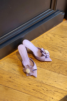 Christin Wu Wendy heels in periwinkle color, featuring a stylish heel design, displayed in a fashion lifestyle setting.