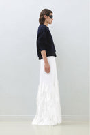 Hand embroidered white whale maxi skirt by TAGG, featuring intricate whale motifs and flowing fabric in a stylish design.