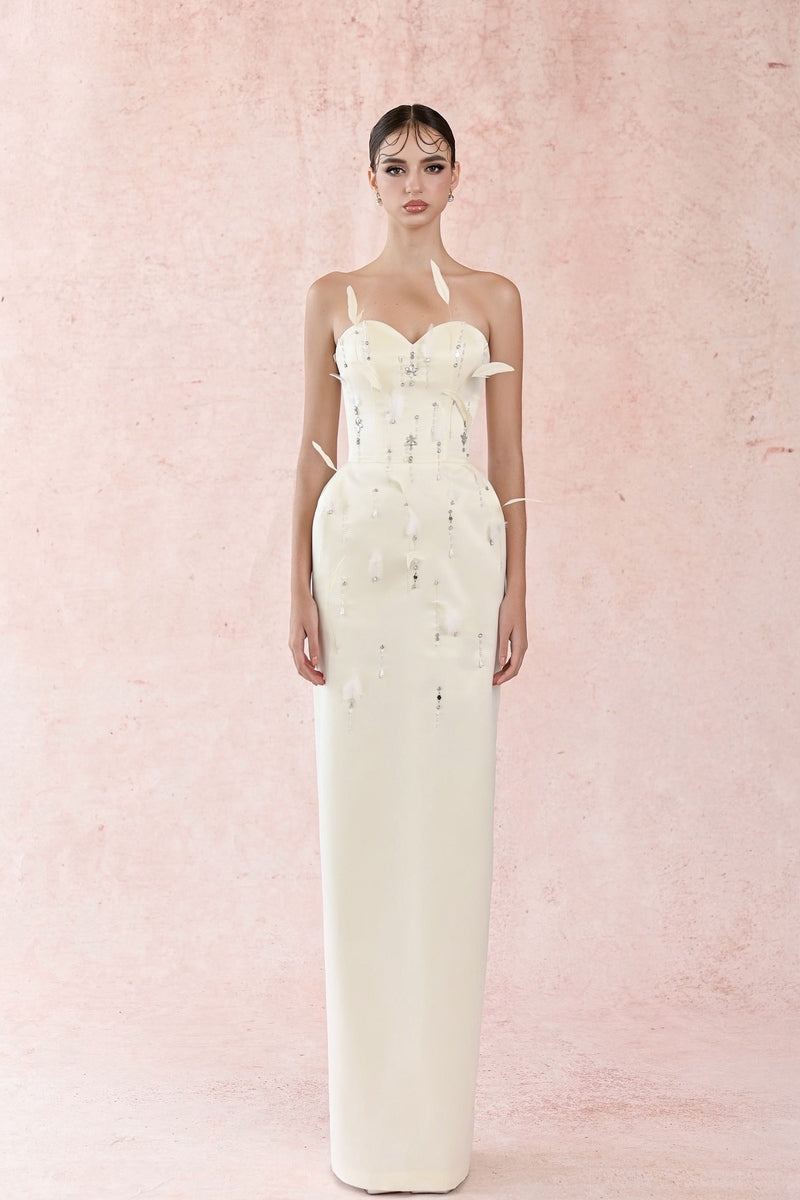 White Feather Charming Gown by HACCHIC COUTURE, elegant white gown featuring feather details and flowing fabric.