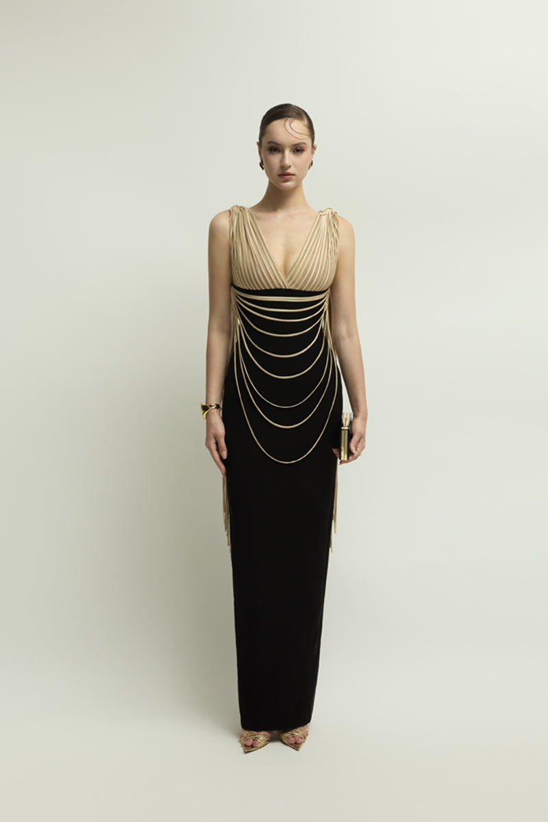 Jenny K Tran Whitshire dress in beige and black, elegant gown with a flowing design, displayed on a mannequin.