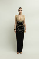 Jenny K Tran Whitshire dress in beige and black, elegant gown with a flowing design, displayed on a mannequin.