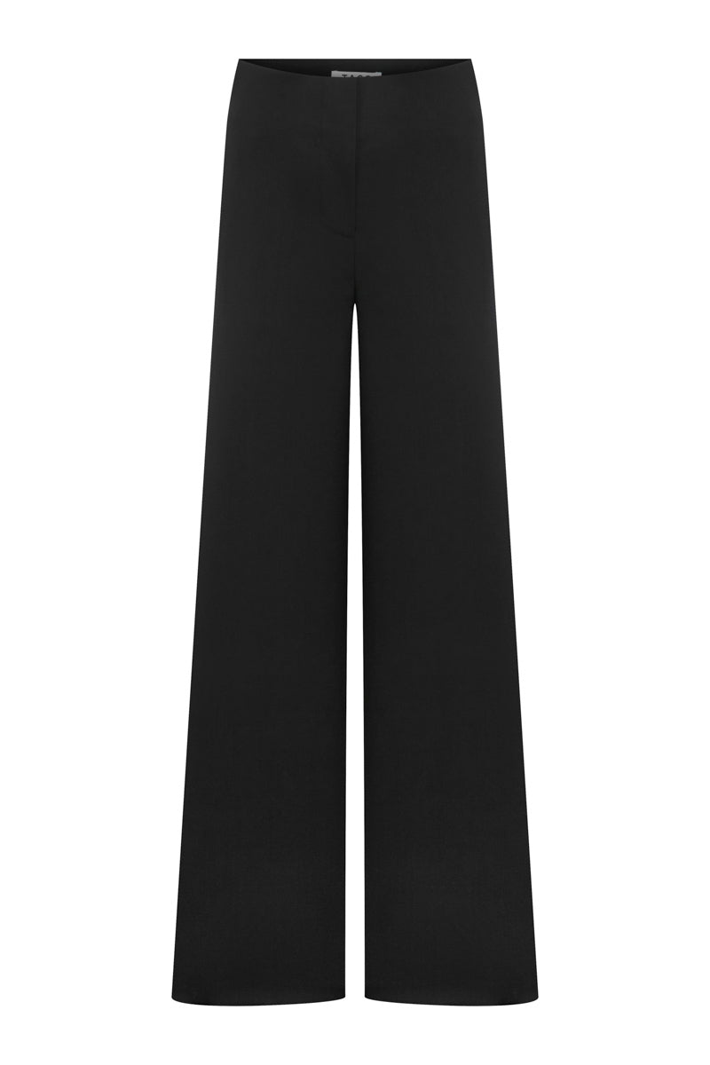 Tagg wide leg pants with relaxed fit, featuring lightweight fabric, high waist, and flowing silhouette.