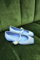 Christin Wu WILLA flats in bluebell color, showing a stylish pair of lightweight, slip-on flats on a casual outdoor setting.