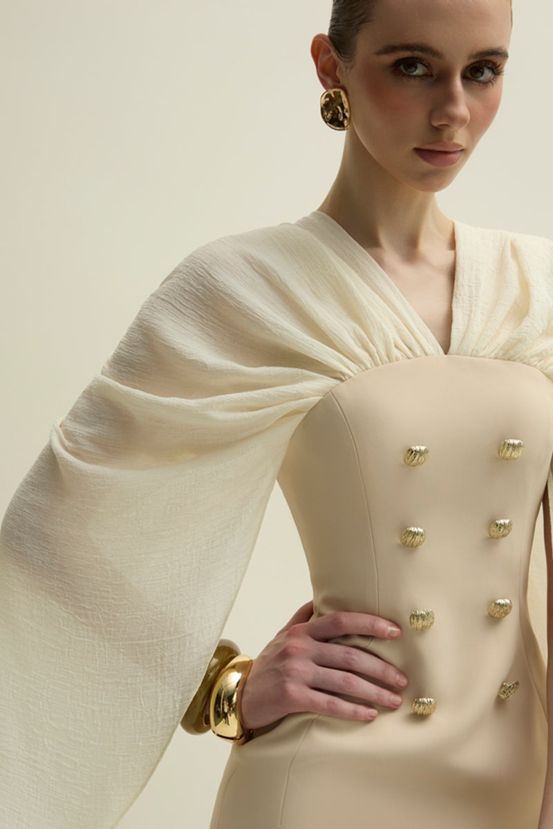 Jenny K Tran Willow Dress in ivory and beige, elegant gown with flowing fabric and subtle detailing, perfect for formal occasions.