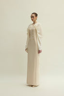 Jenny K Tran Willow dress in ivory and beige, elegant gown with flowing fabric and subtle detailing, perfect for special occasions.