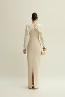 Jenny K Tran Willow dress in ivory and beige, elegant gown with flowing fabric and subtle detailing, perfect for formal occasions.