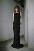 Black woven braided maxi dress by MAZ Manuela Álvarez, featuring a stylish and textured design perfect for elegant occasions.