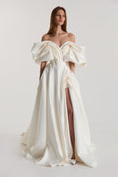 Off-White Volume Sculpted Gown by Monetre, elegant evening gown with sculpted details and flowing fabric.