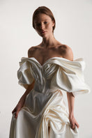 Off-White volume sculpted gown by Monetre, featuring a flowing design with intricate detailing, perfect for elegant occasions.