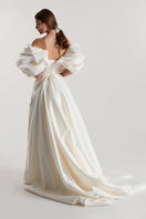 Off-White Volume Sculpted Gown by Monetre, elegant evening gown with structured design and sculpted silhouette, black fabric.