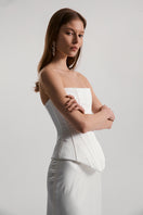 Off-white satin Dita corset top by Monetre featuring structured design and sleek fabric, perfect for stylish evening wear.