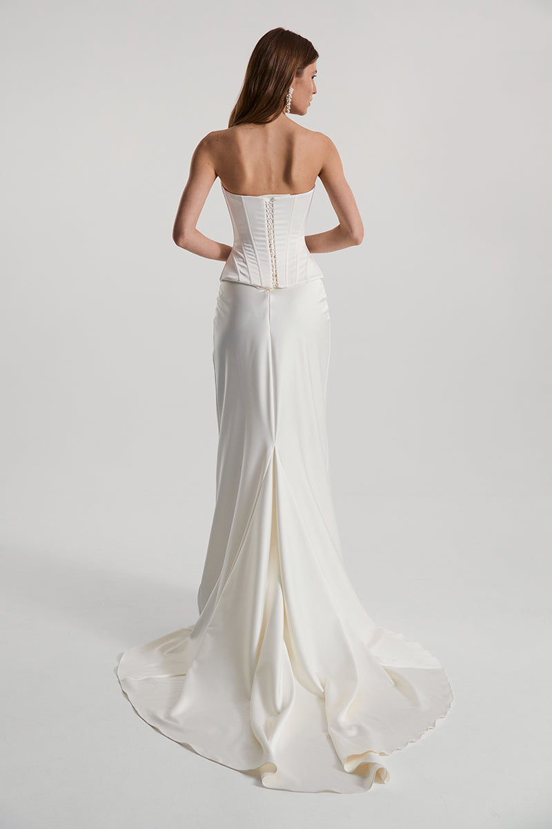 Off-white satin DITA corset top by Monetre, featuring structured design and elegant detailing, displayed on a neutral background.