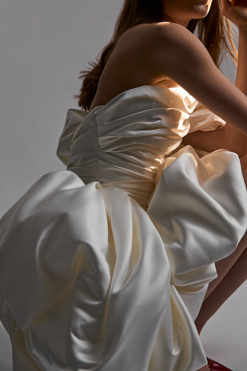 Off-white satin mini dress by Monetre, featuring a stylish and elegant design, perfect for chic occasions.