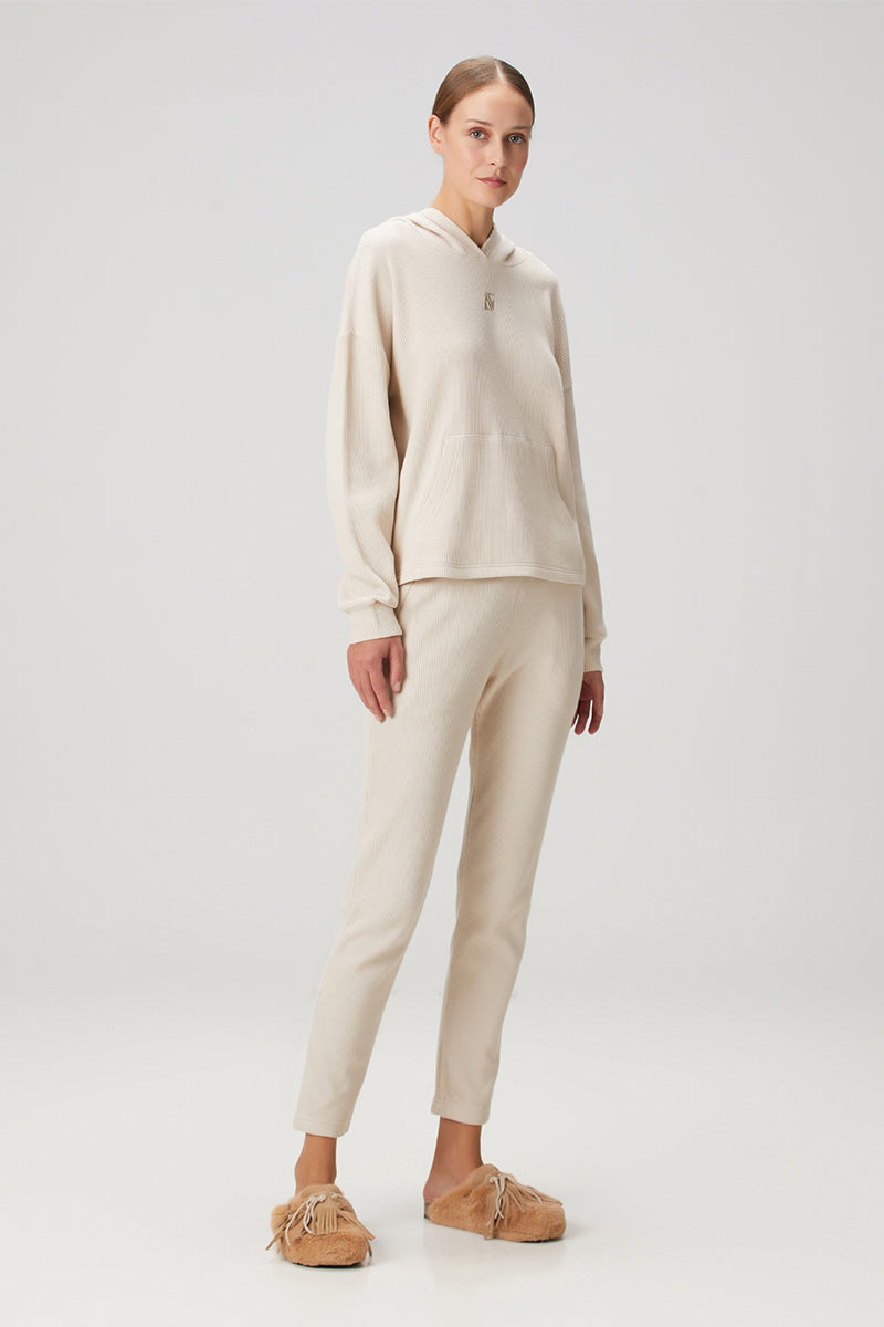 Beige waffle sweatpants by Bassigue featuring a cozy, textured fabric and relaxed fit for casual comfort.