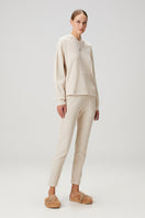 Beige waffle sweatpants by Bassigue, showcasing soft, textured fabric and relaxed fit for casual comfort.