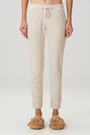 Beige waffle sweatpants by Bassigue, casual pants with textured waffle pattern, relaxed fit, and comfortable waistband.