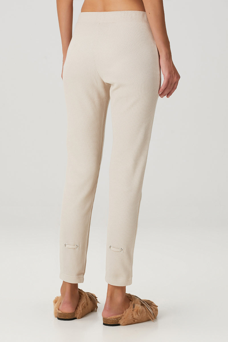 Beige waffle sweatpants by Bassigue, showing relaxed fit and textured fabric, perfect for casual and comfortable wear.