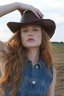Modern Monarchie walnut hat in espresso color, stylish and versatile accessory with a classic hat shape and textured finish.