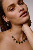 Silver drop earrings with Paua shell inlay by Freya Rose, featuring intricate warrior-inspired design.