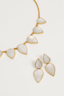 Gold Warrioress Drop Earrings by Freya Rose featuring elegant pearl accents and a sleek, modern design.