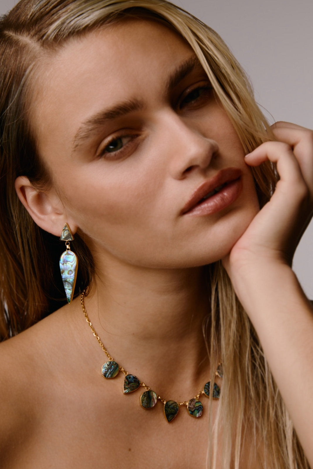 Small WARRIORESS necklace in Paua shell by Freya Rose featuring a delicate design on a silver chain.