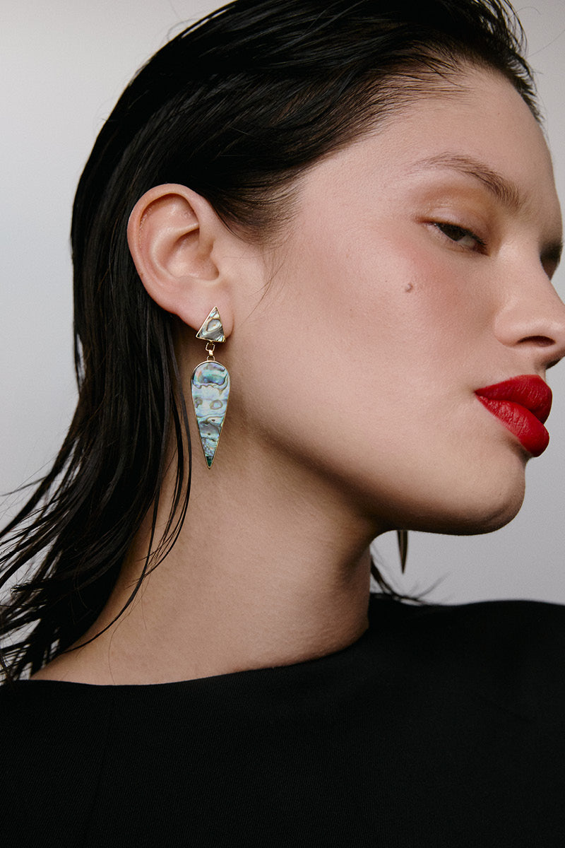Freya Rose WARRIORESS WONDER earrings in paua shell, featuring intricate design and vibrant blue-green iridescence.