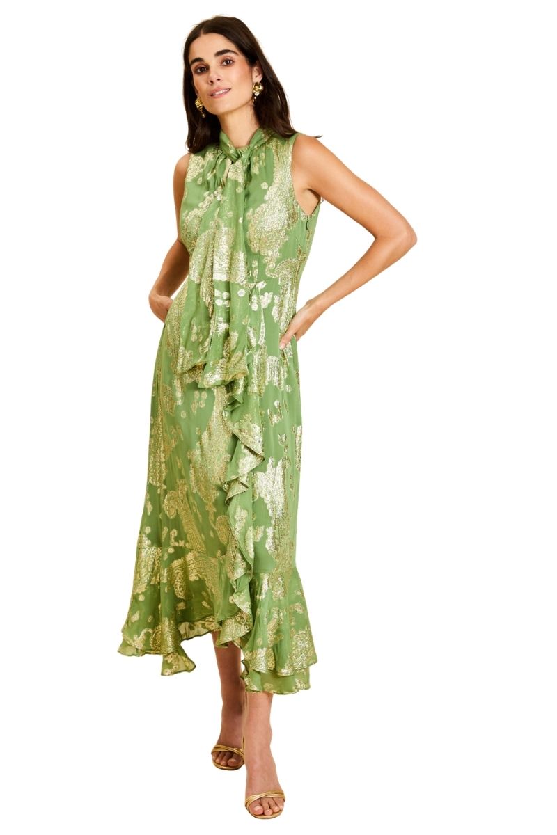 Mestiza New York Waverly midi dress in flowing fabric with a fitted waist and elegant design, displayed on a hanger.
