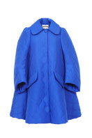 Blue quilt swing coat by Chictopia displayed on a hanger, showcasing its quilted pattern and stylish design.