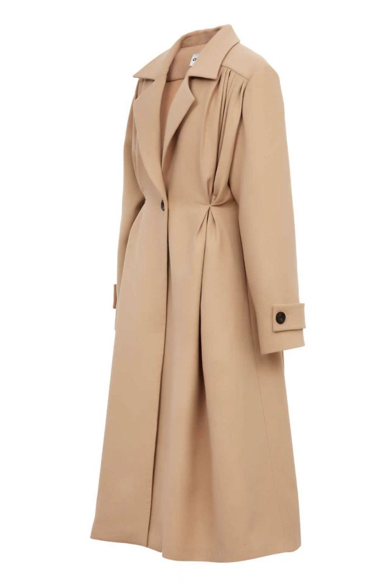 Beige wool coat with pleats from Chictopia, shown on a hanger, featuring a tailored fit and classic style.