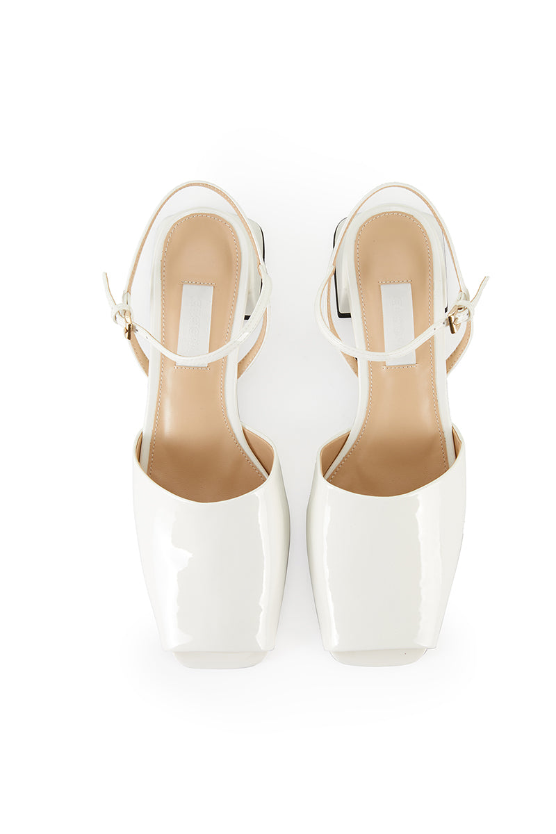 Ivory peep toe slingback heels by Chictopia, featuring a stylish open-toe design and elegant ankle strap on a white background.