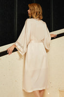 Pink silk wedding lace long robe by MANITO, featuring delicate lace details and flowing fabric perfect for special occasions.