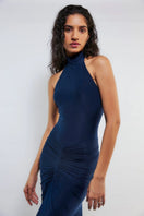Navy blue high-neck gown by Deme By Gabriella featuring a elegant design and flowing fabric, displayed on a hanger.