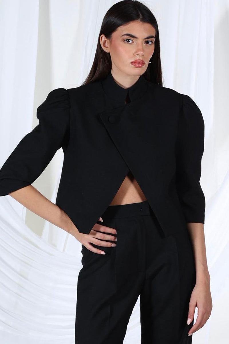 Black Opal Pants by Aquarel Studio featuring a relaxed fit and stylish design, shown on a model in a casual setting.