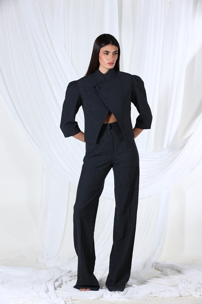 A black blazer from Aquarel Studio's Lunar Blazer collection, featuring a tailored fit and sleek design, shown on a model.