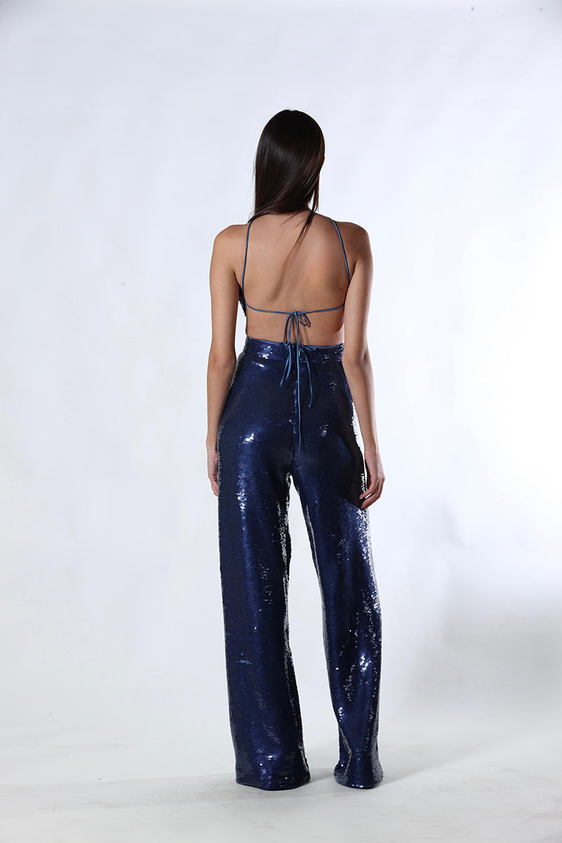 A pair of blue Aquarel Studio ZAYA pants with a relaxed fit, shown laid flat on a white background.