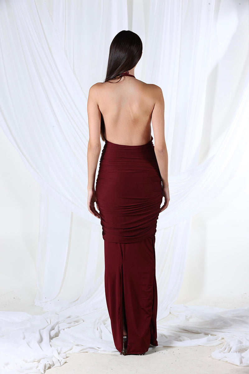 Aquarel Studio burgundy Stella maxi dress displayed on a hanger, showcasing its flowing fabric and elegant design.