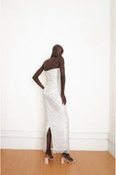 Silver YASSMIN SALEH Whispers Gown with elegant back design, flowing fabric, perfect for formal occasions.