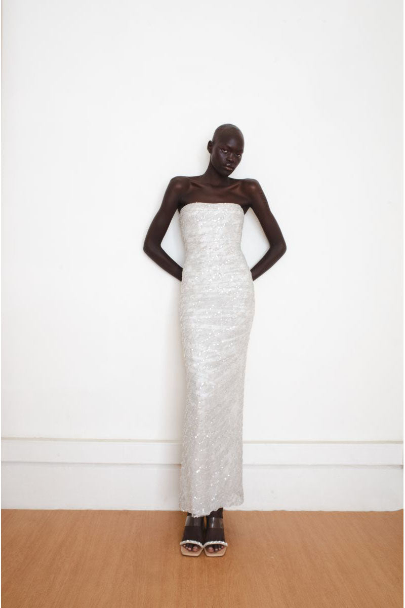 Silver Whispers Gown by YASSMIN SALEH, front view showcasing elegant design and flowing fabric for formal occasions.