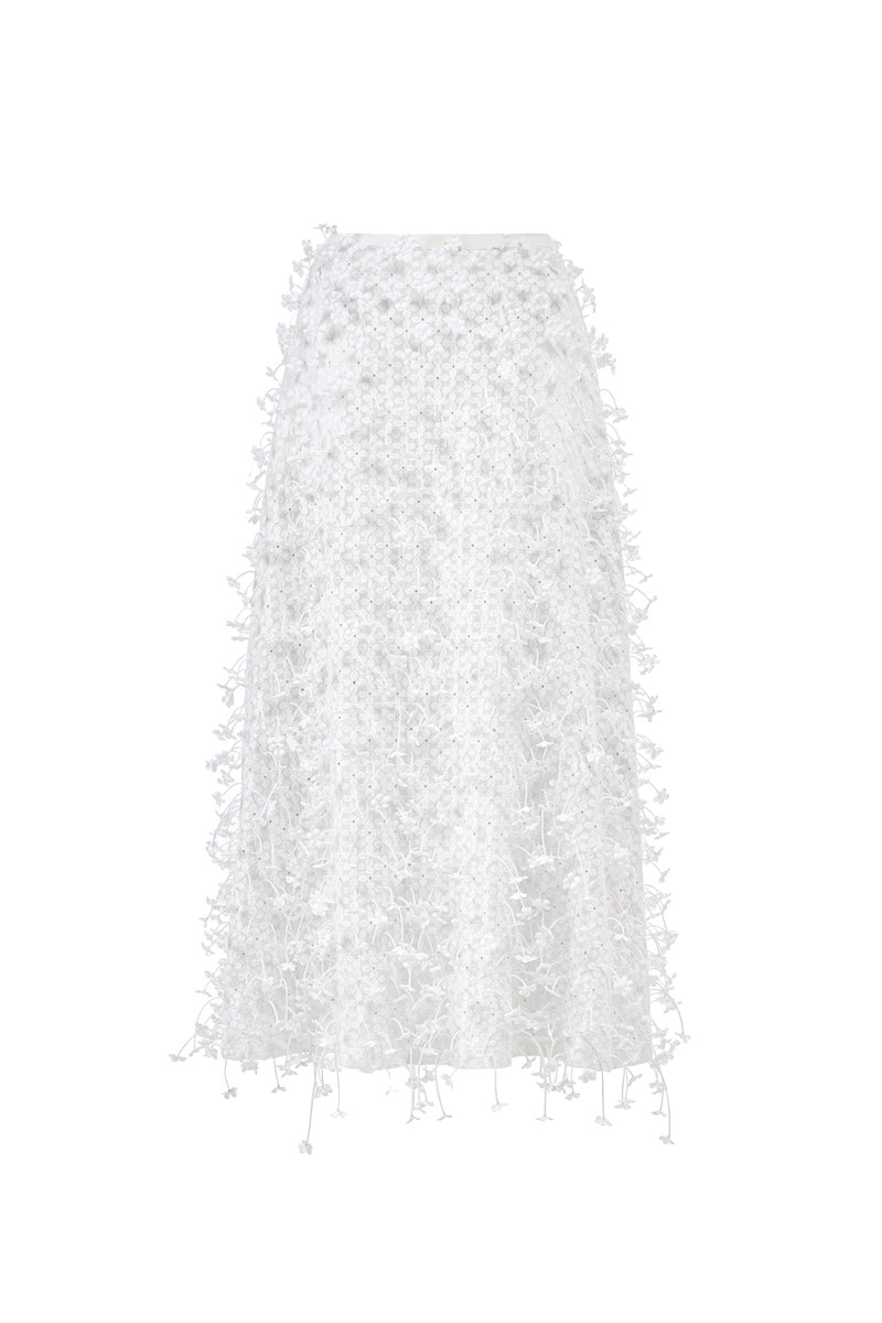 White 3D floral midi skirt by Montsand, showcasing intricate 3D floral embroidery and flowing midi length fabric.