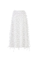 White 3D floral midi skirt by Montsand, featuring intricate 3D floral details and a flowing midi length for elegant style.