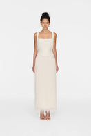 Elegant white Andrea gown by Montsand, featuring flowing fabric and a stylish design perfect for formal occasions.
