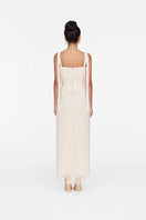 White Andrea gown by Montsand featuring elegant fabric and a flowing silhouette, perfect for formal occasions.