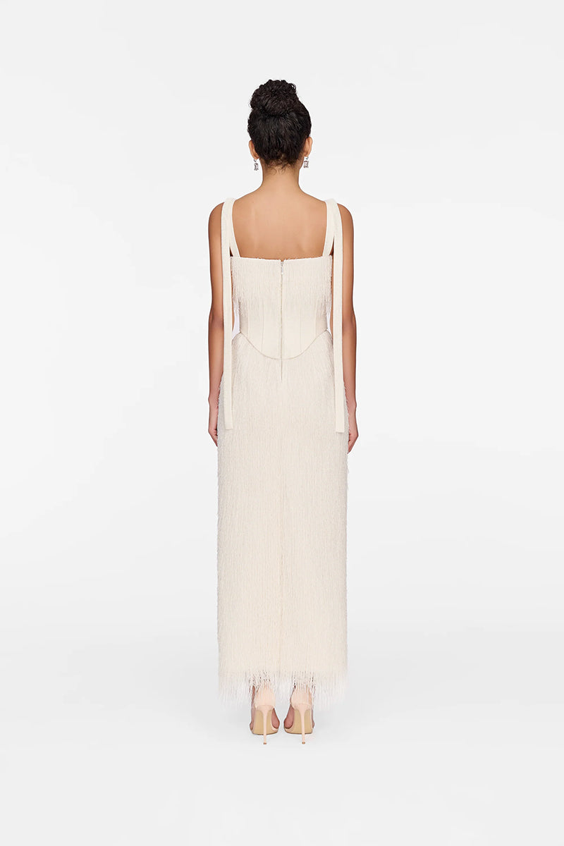 White Andrea gown by Montsand featuring elegant fabric and a flowing silhouette, perfect for formal occasions.