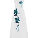 White asymmetrical flared maxi dress by Tiny Ink, featuring flowing fabric and stylish design, perfect for elegant summer wear.