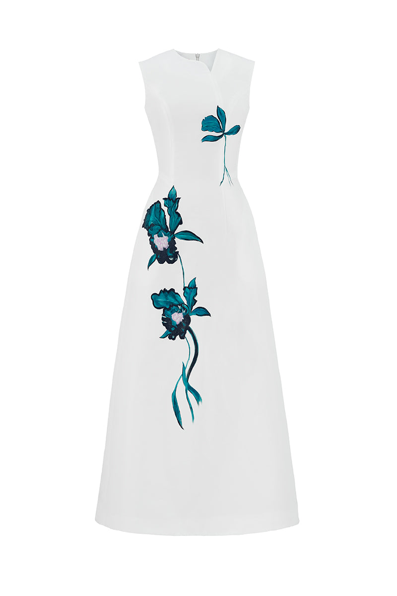 White asymmetrical flared maxi dress by Tiny Ink, featuring flowing fabric and stylish design, perfect for elegant summer wear.