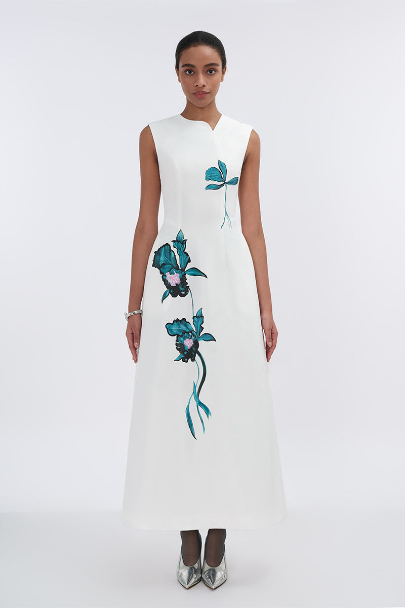 White asymmetrical flared maxi dress by Tiny Ink, featuring a flowing silhouette and stylish design perfect for summer wear.