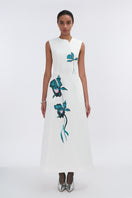 White asymmetrical flared maxi dress by Tiny Ink, featuring a flowing silhouette and stylish design perfect for summer wear.