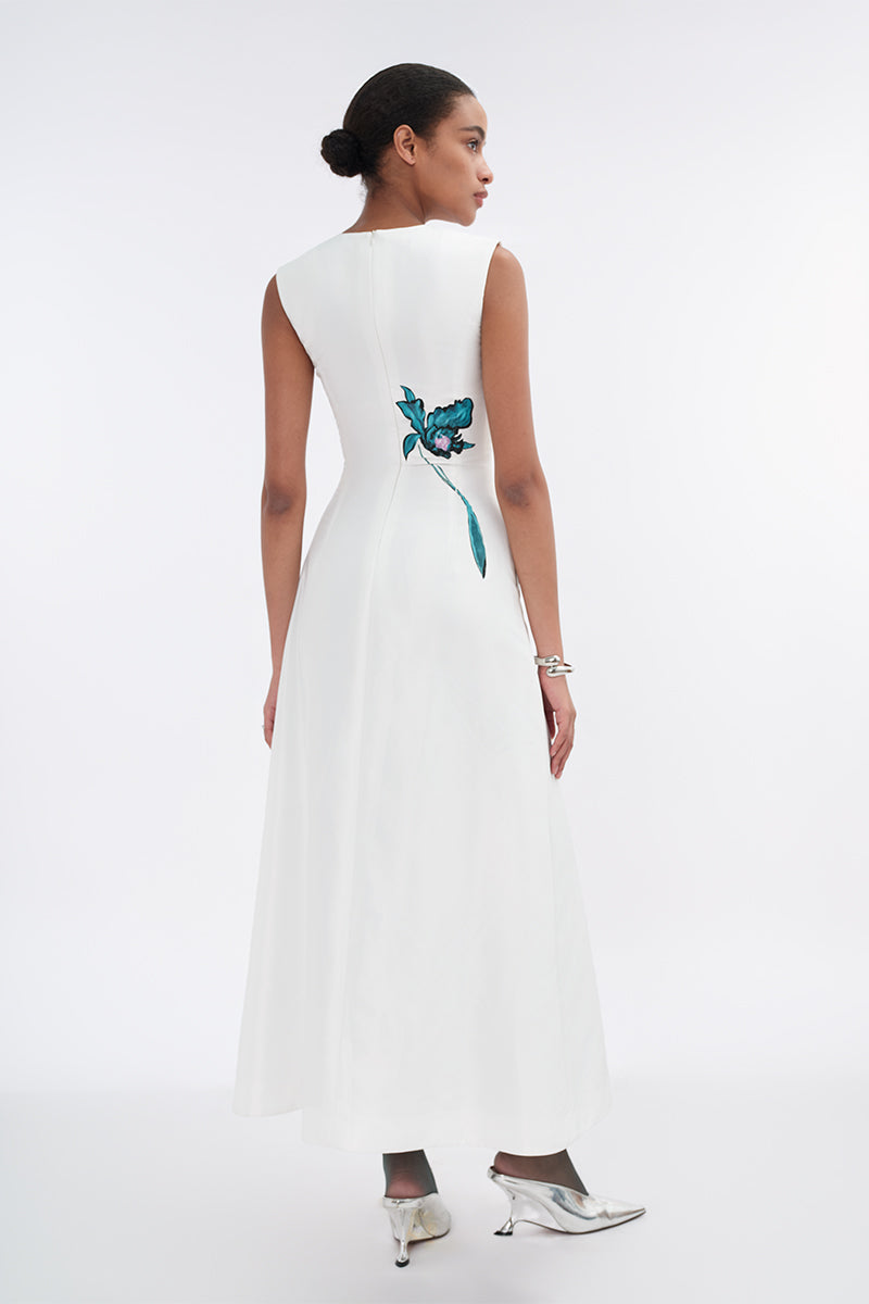 White asymmetrical flared maxi dress by Tiny Ink, featuring flowing fabric and stylish design, perfect for elegant occasions.